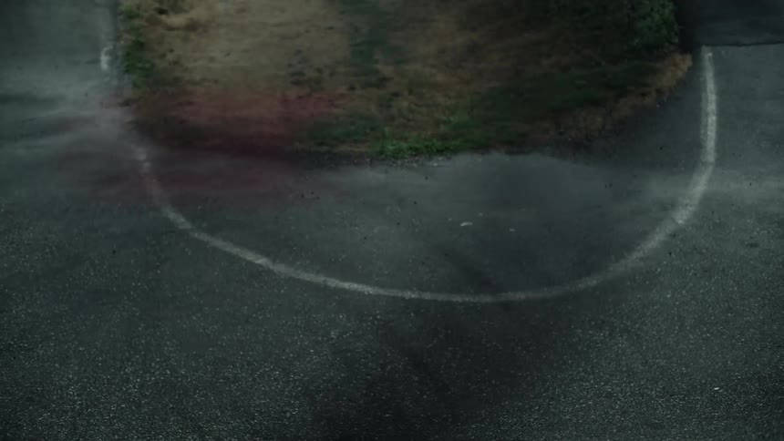Blurry people riding bycicles pass in front of the camera