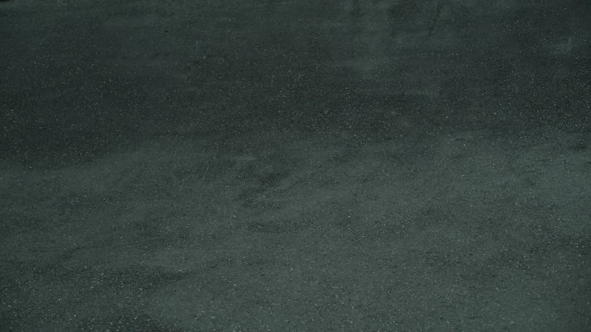 A person speeding by on a bicycle