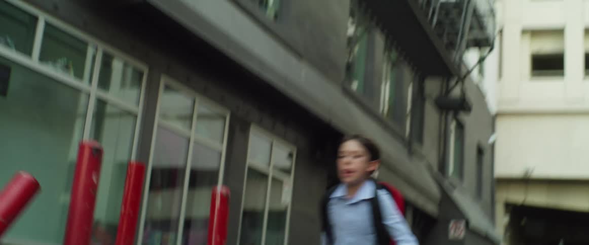 A child runs through the city