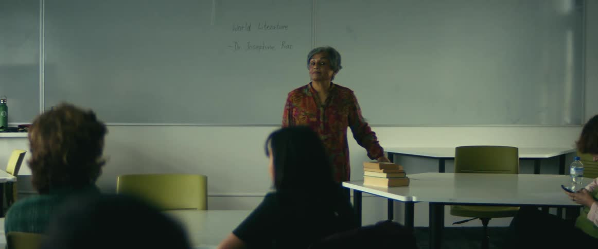 Professor moves about classroom while giving a lecture