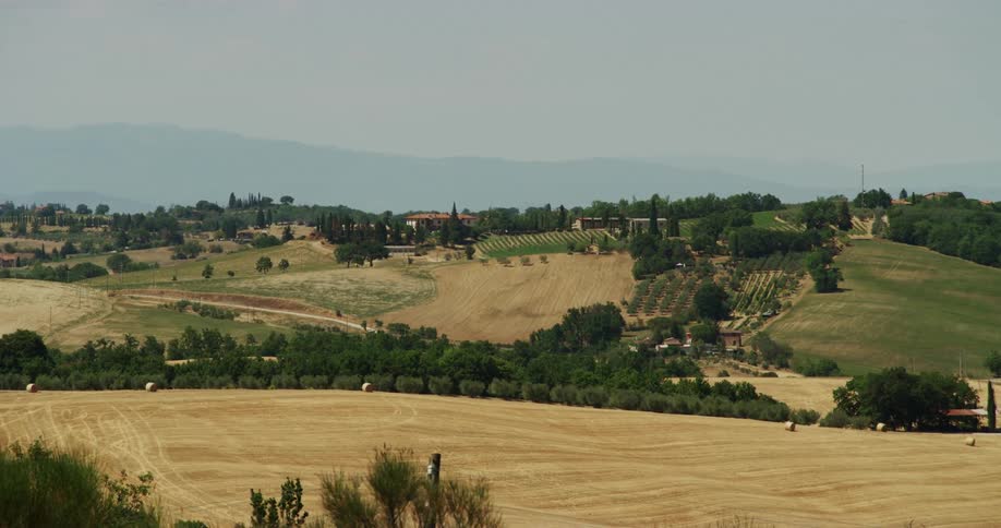 Farmland sprawls out on the rolling hills