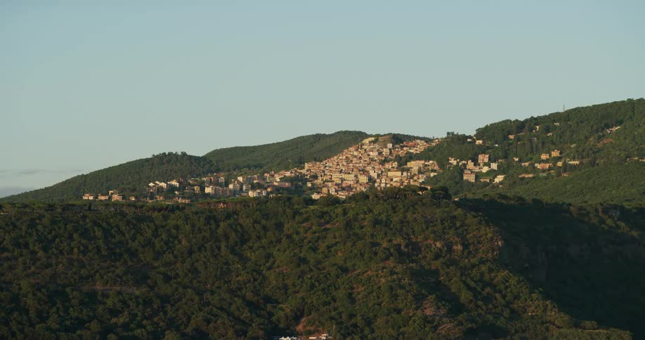 The small town of rocca di papa in italy built into a green hill and ridge