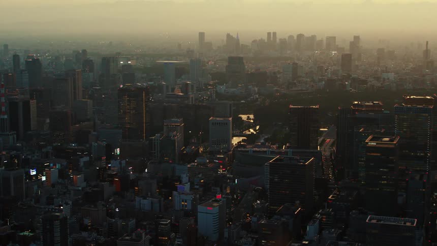 A dense neighborhood sits across from a congested downtown