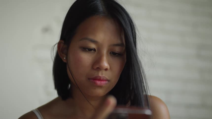 A woman is using her phone