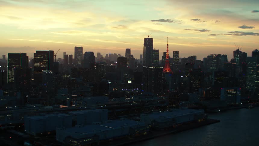 The city is lit at sunset