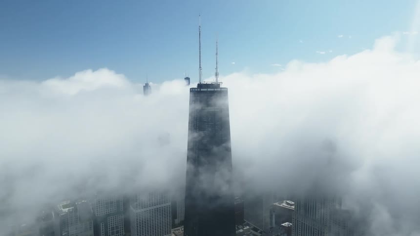 The clouds float on the buildings