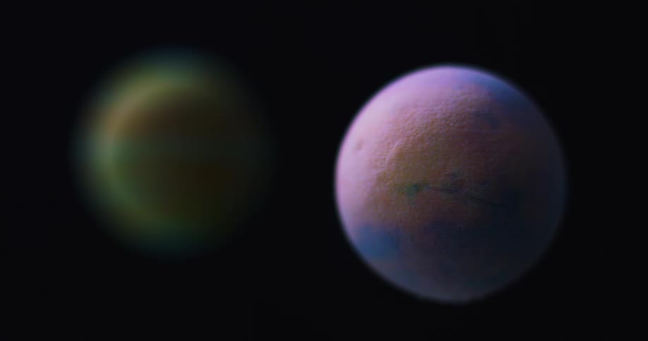 An orb is spinning in front of another sphere