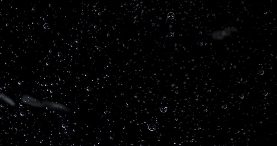 Abstract footage of bubbles in a black substance