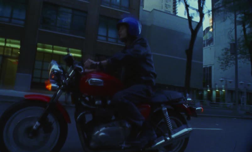 A man is driving a motorcycle