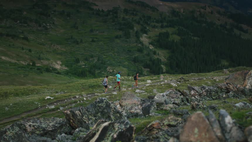 Three men trail running in the hills