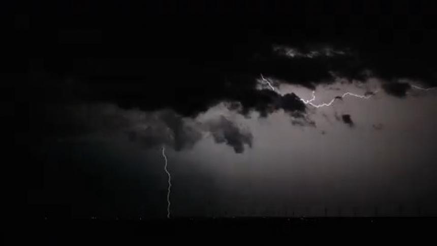 Rolling thunder and flashing skies at night