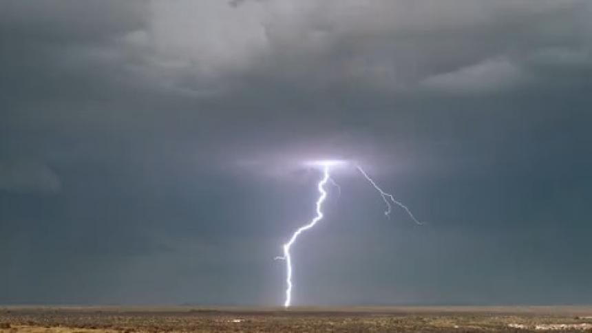 Heavy storm clouds shoot lightning to the ground