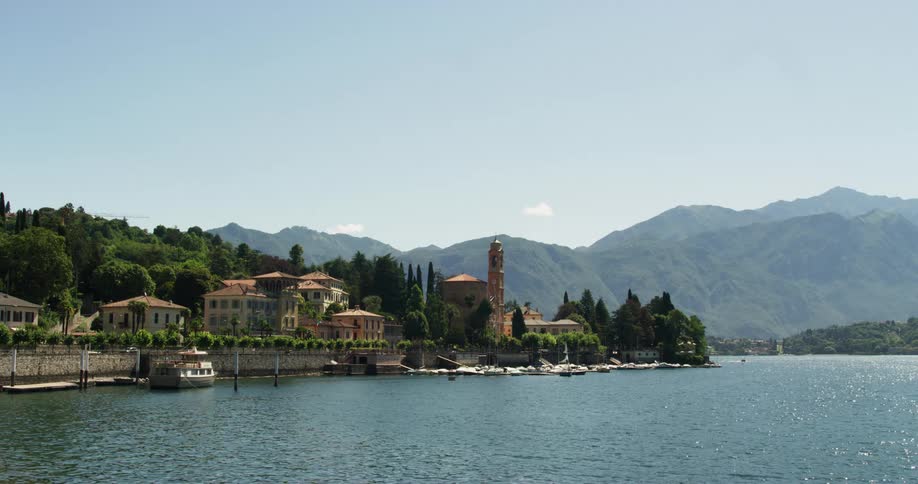 Tremezzo on lake como in italy with sparkling water and mountains and hills