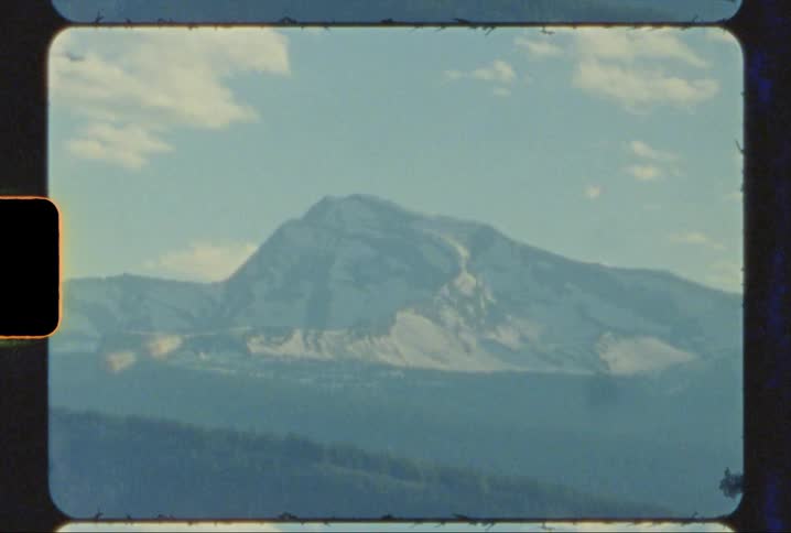 Heavens Peak shining at golden hour in glacier national park shot on 8mm film