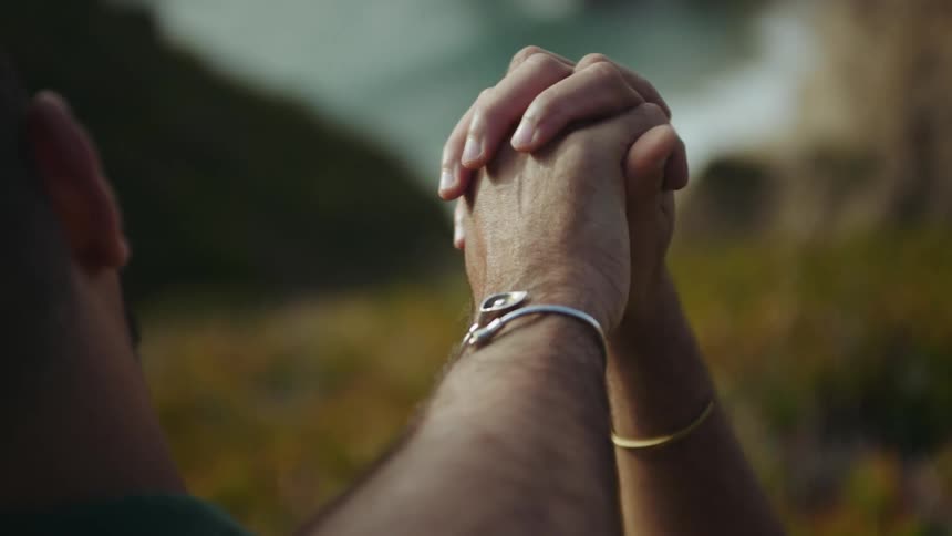 Affectionate hand holding with gentle thumb movement