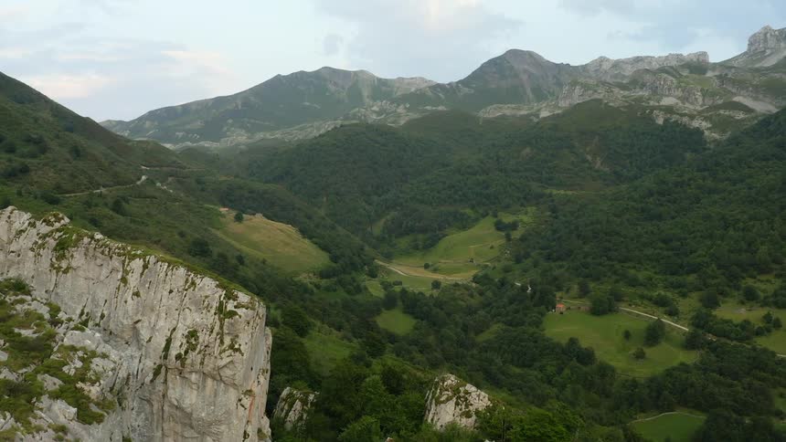 Aerial view of a scenic Asturian mountain range and lush valley