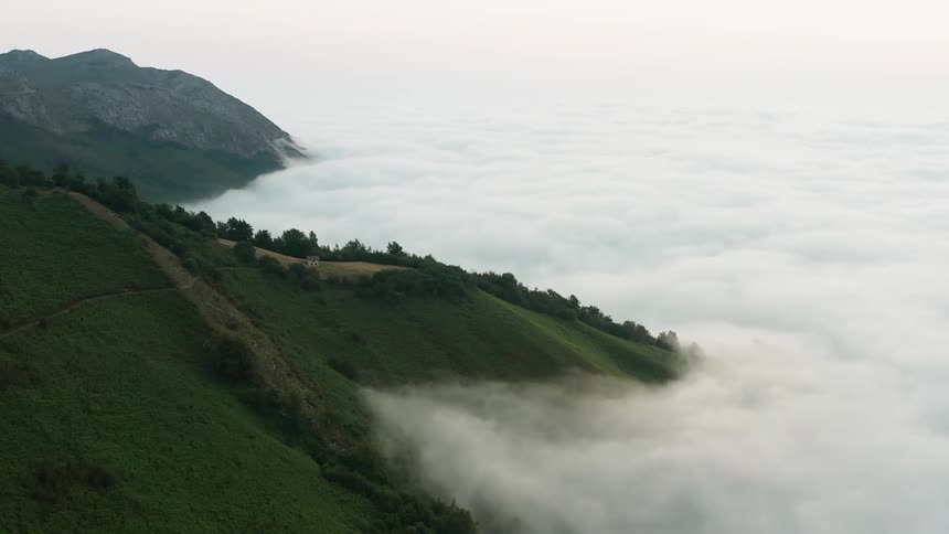 The clouds are covering the mountains in northern Spain