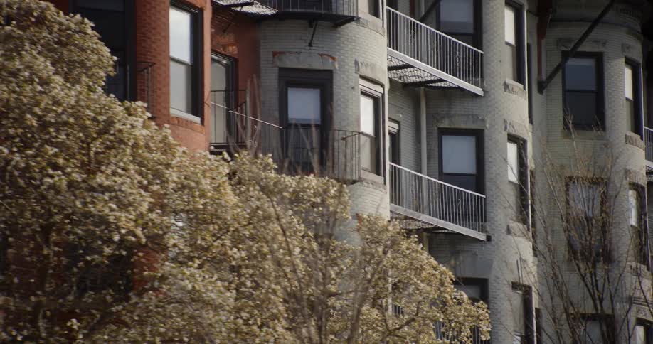 Exterior view of block of apartment buildings with balconies and and windows