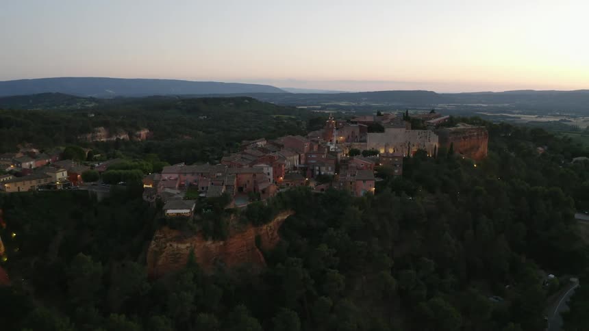 A town sits on the top of the mountain