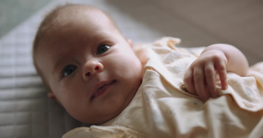 A baby is laying down