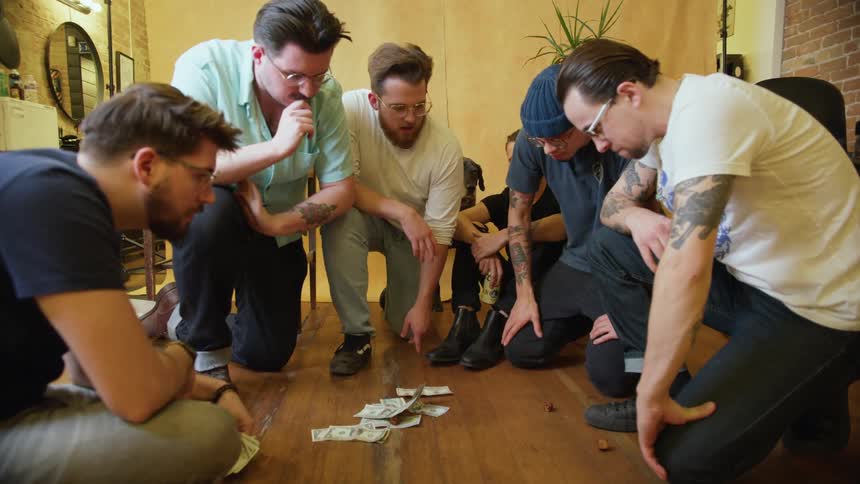 A group of men are playing games together indoors