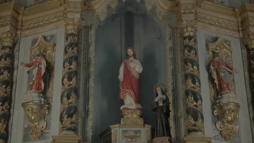 Religious statues line the wall