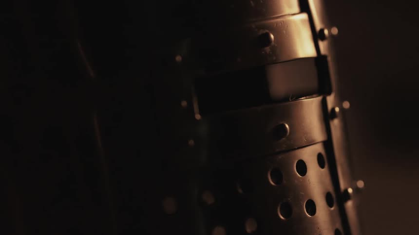 Light reflects off a metal helmet