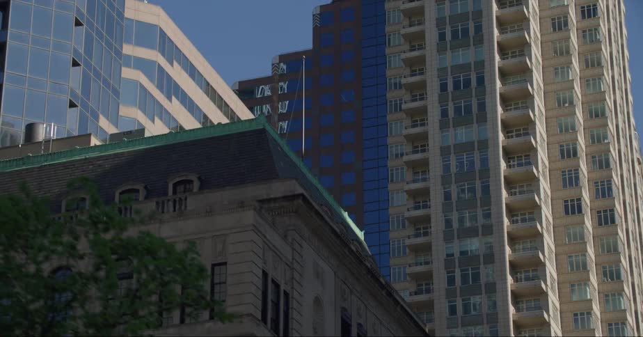 Tall apartment buildings fill the sky