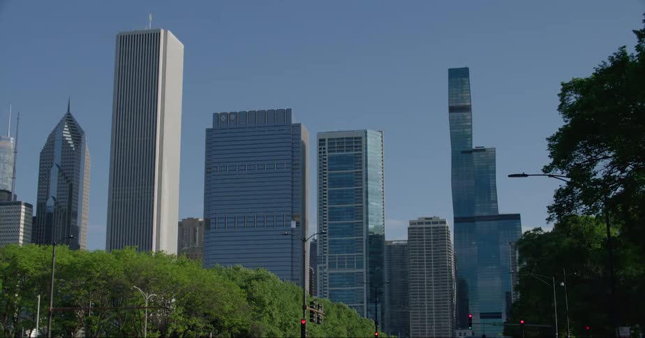 Moving into downtown tall buildings and skyscrapers stand tall on the city skyline