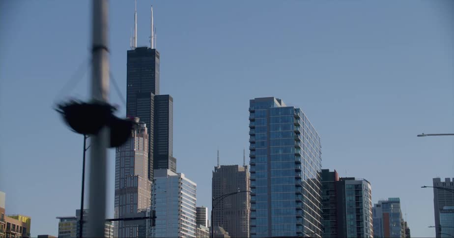 Divided street passes through city downtown on a clear day