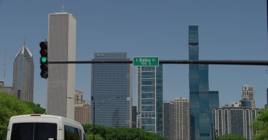 Vehicles drive through a city intersection