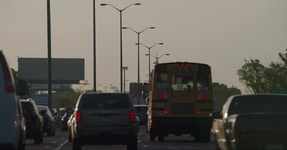 Vehicles driving down a city street