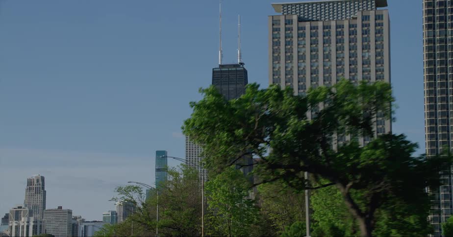 Exterior view of tall john hancock center skyscraper and office buildings in the city