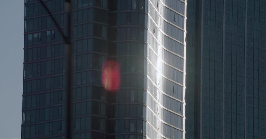 The tall building is reflecting the sun