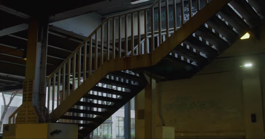 Steps leading up to the elevated train platform in a city