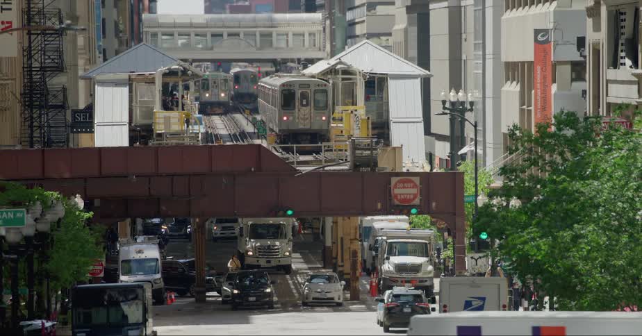 Heavy traffic drives under elevated train tracks