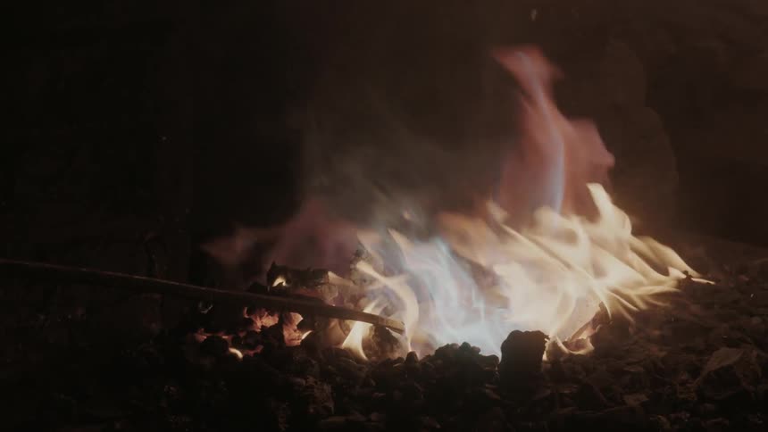 A camp fire burning at night
