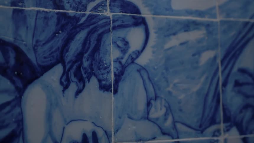 A wall has a painting of people on it
