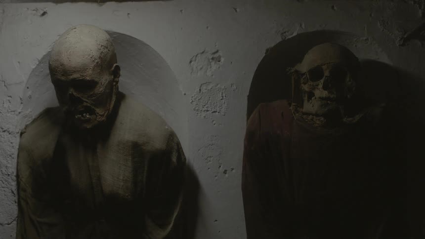 Two decayed corpses lay in their crypt