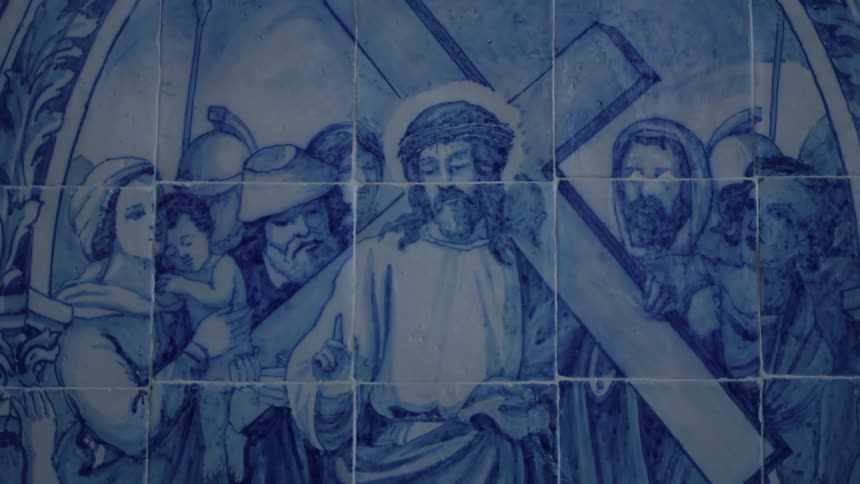 A wall has a religious painting on it