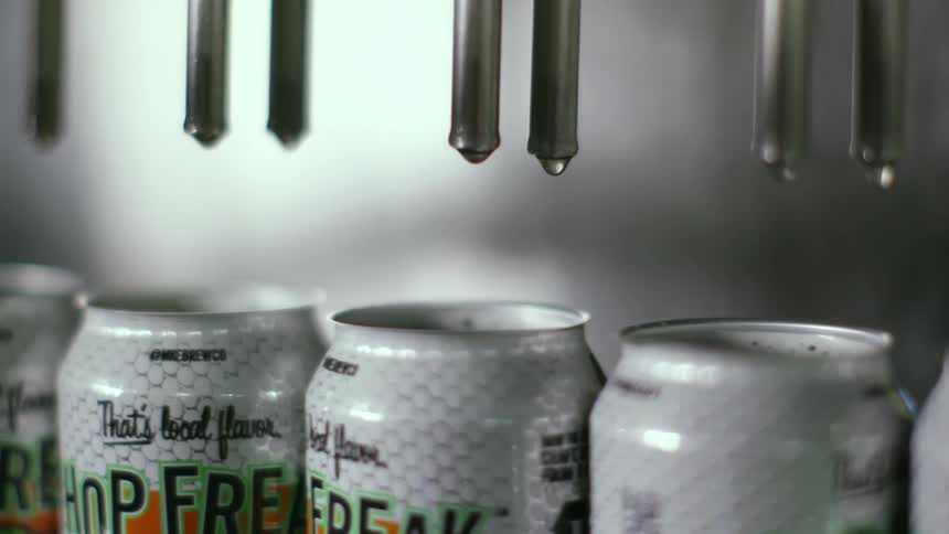 Spouts coming out of cans in a factory
