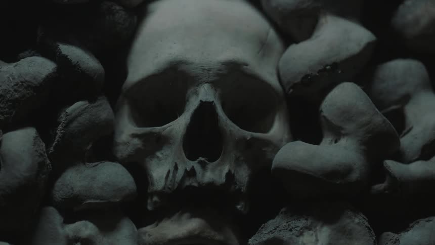Light flashes on a stack of bones