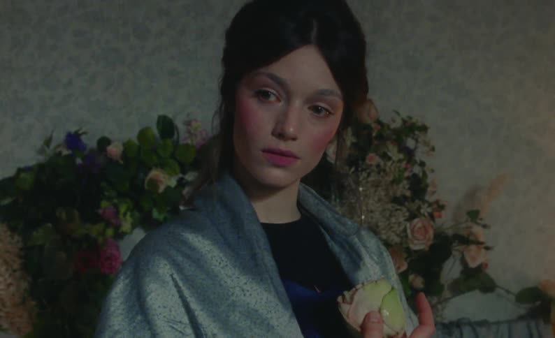 A model is posing in the room