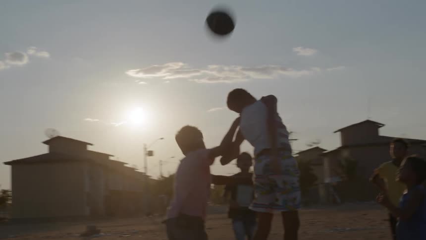 Kids are playing outside with each other in the day time