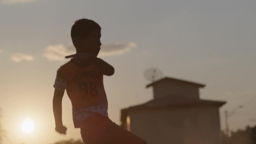 A child kicks the soccer ball