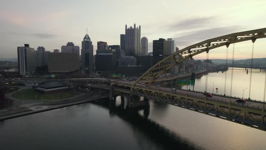 Aerial view of traffic on the fort pitt bridge over the monongahela river next to the pittsburgh skyline at morning