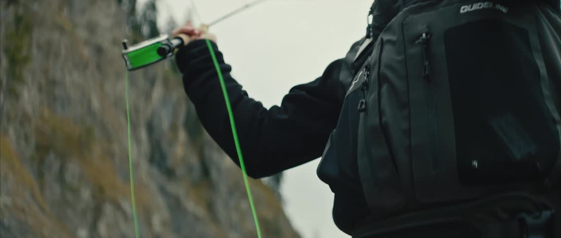 A person is outdoors and is fishing on the water