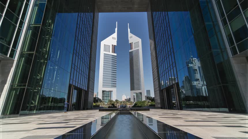 Time lapse view of pedestrians walking in a city is displayed