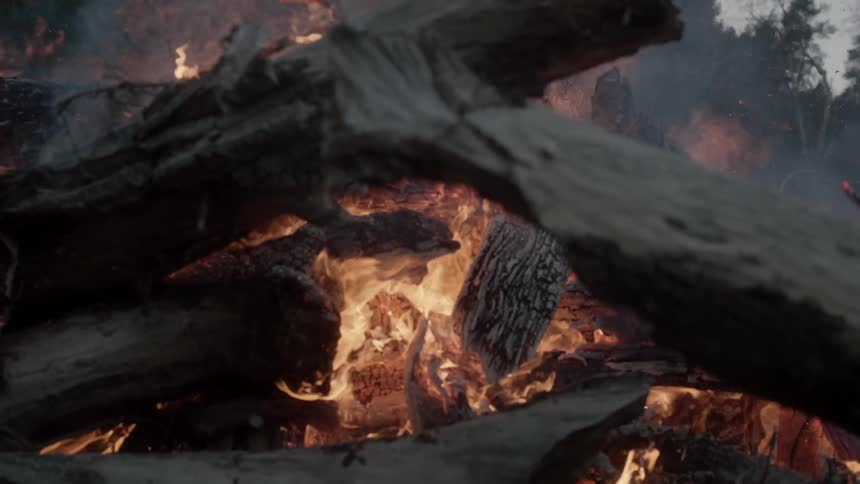 A large fire is going on a cloudy day