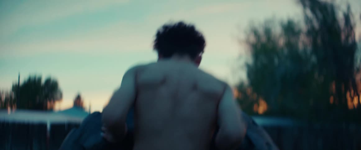 A view of a person flipping a tire outdoors